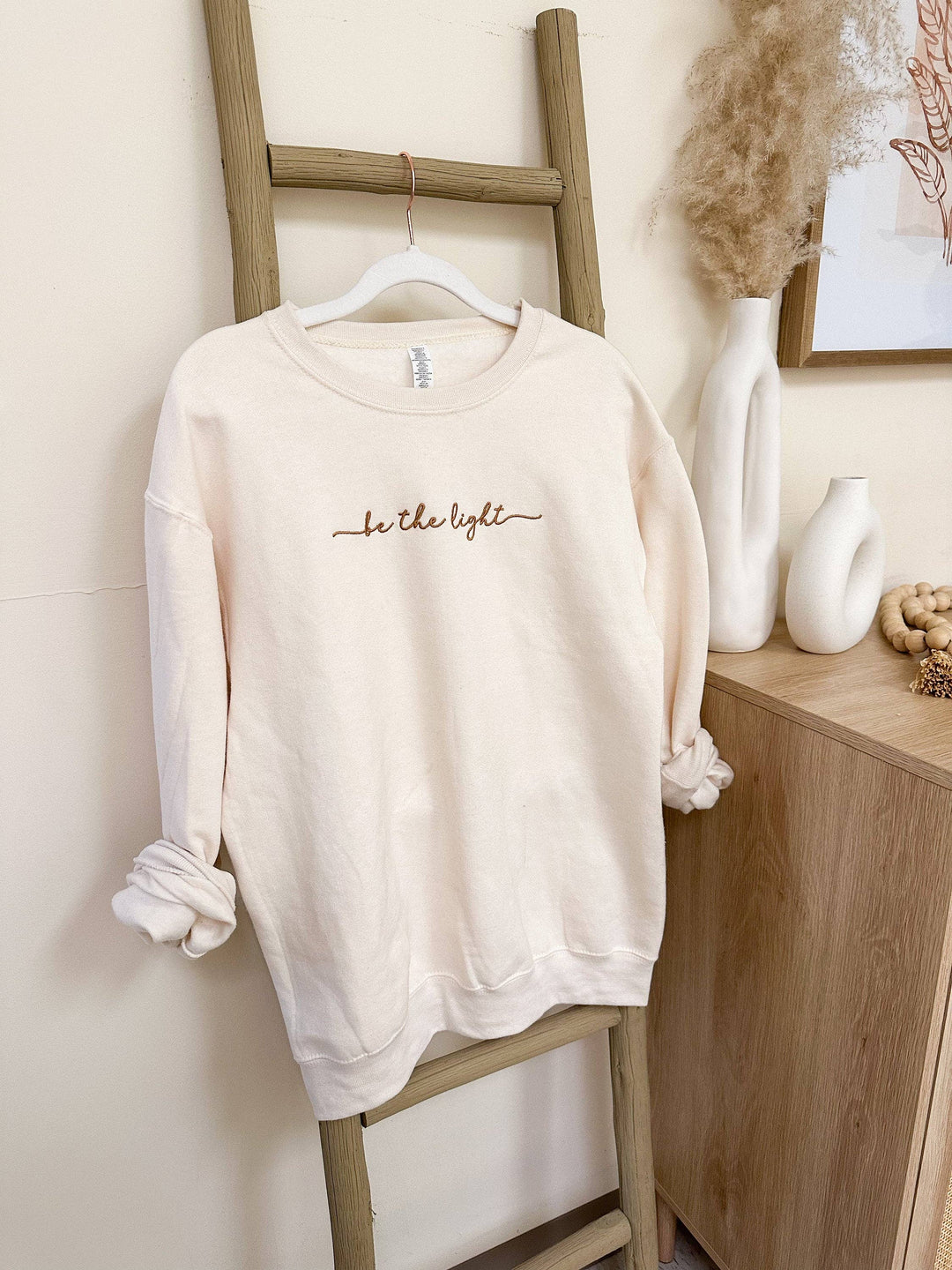 Be The Light Sweatshirt-Graphic Sweaters-Honey Soul LLC-Shop with Bloom West Boutique, Women's Fashion Boutique, Located in Houma, Louisiana