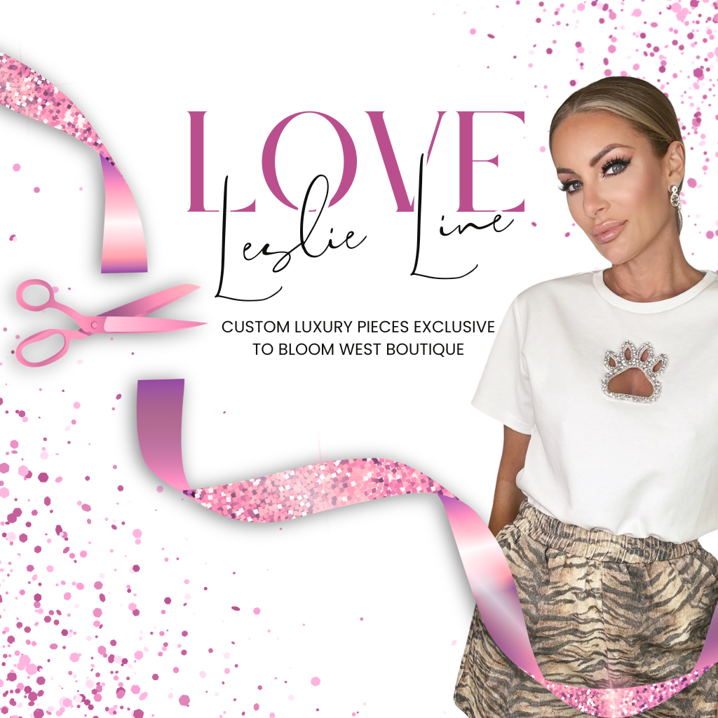 A promotional graphic for 'Love Leslie Line' featuring a woman on the right wearing a white t-shirt with a small brown paw print graphic and patterned skirt. Two smaller inset photos on the left show other clothing styles | Bloom West Boutique | Houma, LA