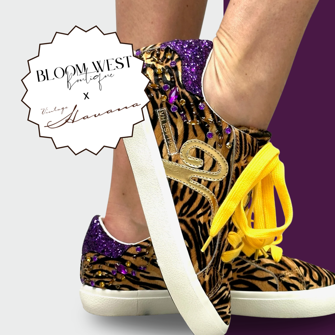 Zebra print sneakers with purple accents and yellow tassels, featuring Bloom West Boutique logo | Bloom West Boutique | Houma, LA