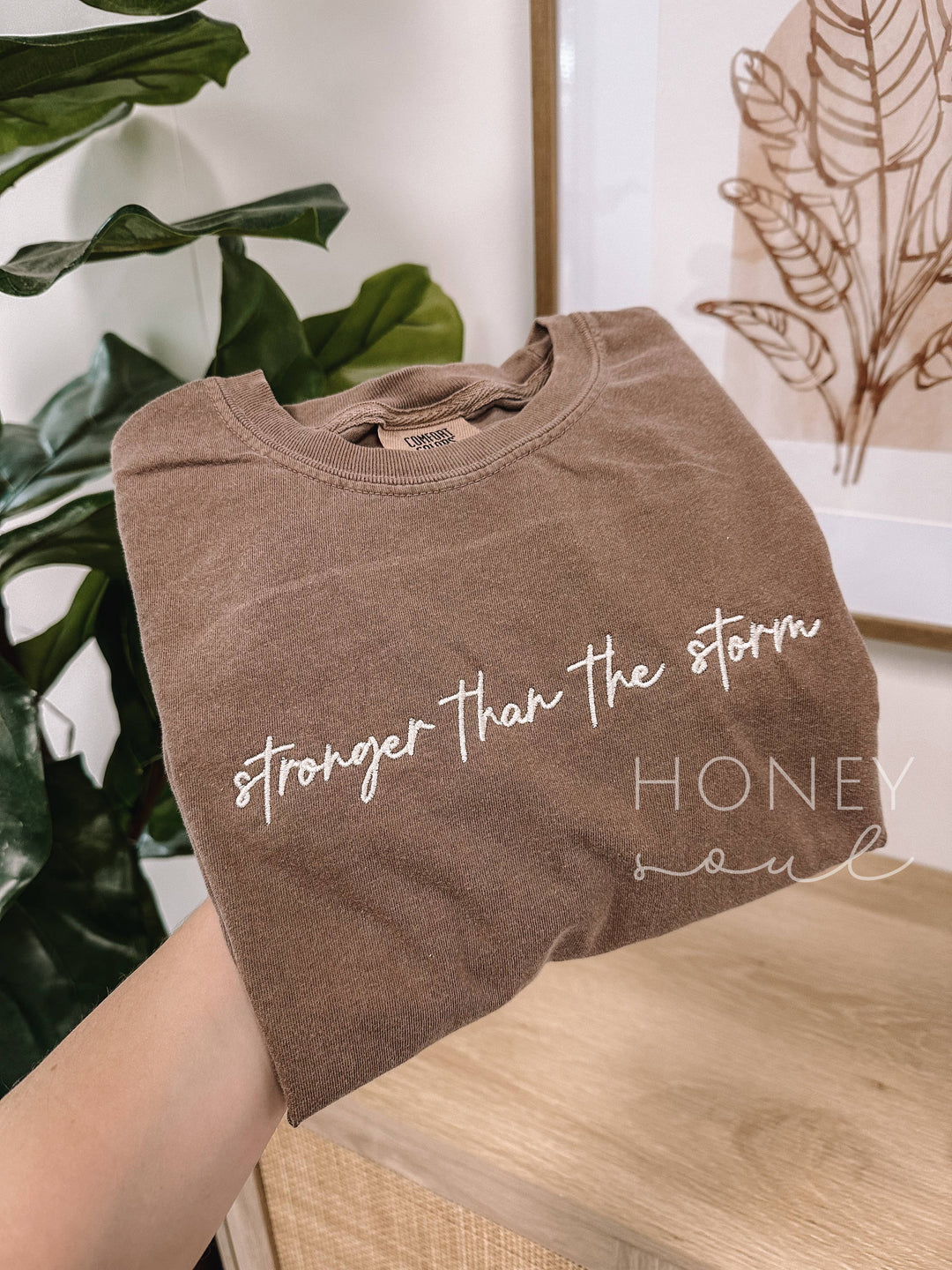 Embroidered Stronger Than The Storm Tee-Graphic Tees-Honey Soul LLC-Shop with Bloom West Boutique, Women's Fashion Boutique, Located in Houma, Louisiana