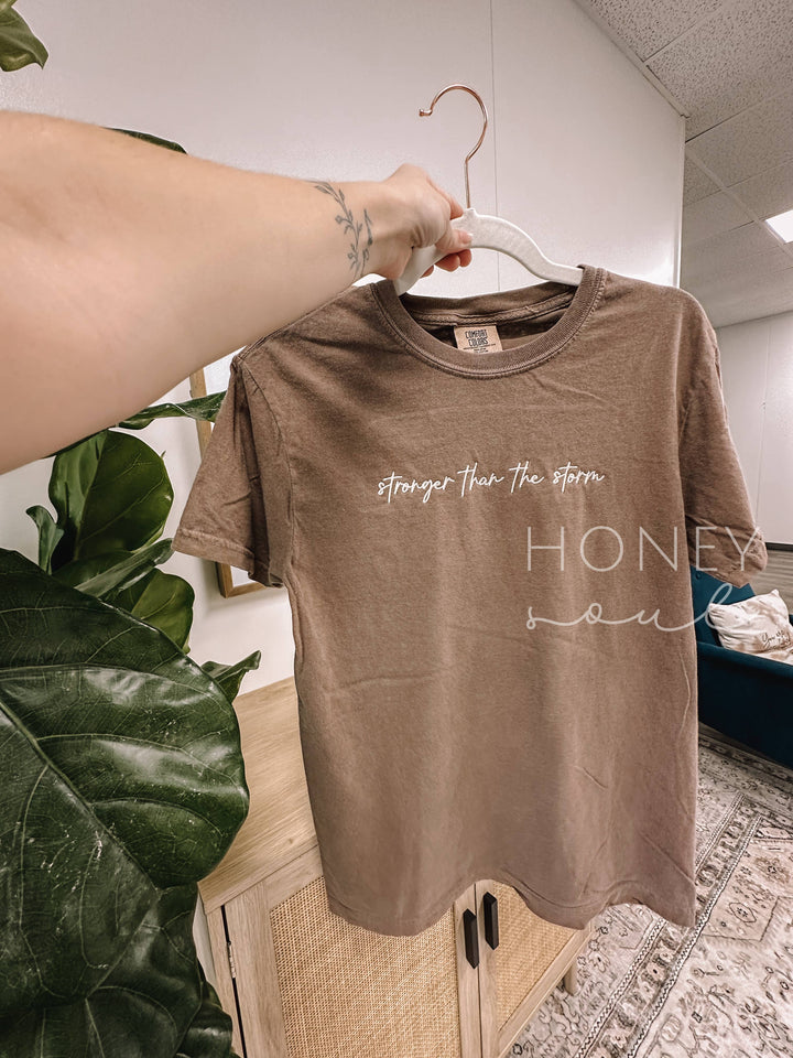 Embroidered Stronger Than The Storm Tee-Graphic Tees-Honey Soul LLC-Shop with Bloom West Boutique, Women's Fashion Boutique, Located in Houma, Louisiana